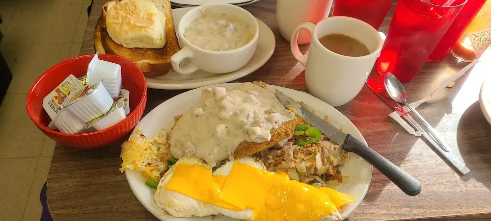 Chicken George with Potatoes O'Brian and a Biscuit with Sausage Gravy Instead of Toast